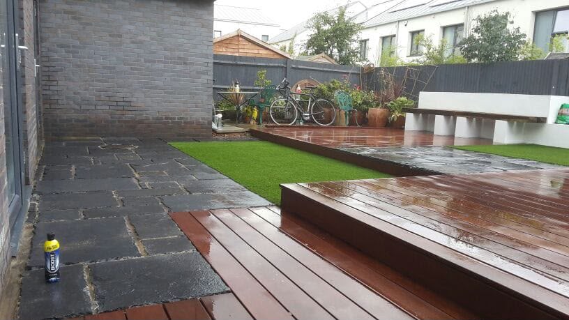 Multi-level hardwood decking with artificial lawn