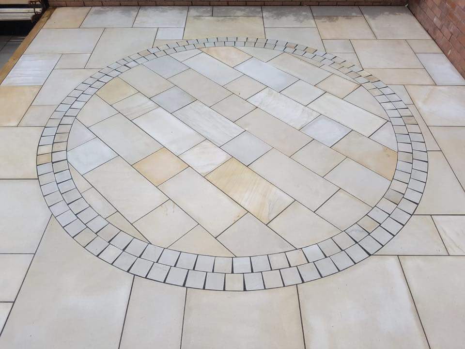 Circular Indian sandstone patio feature with block border