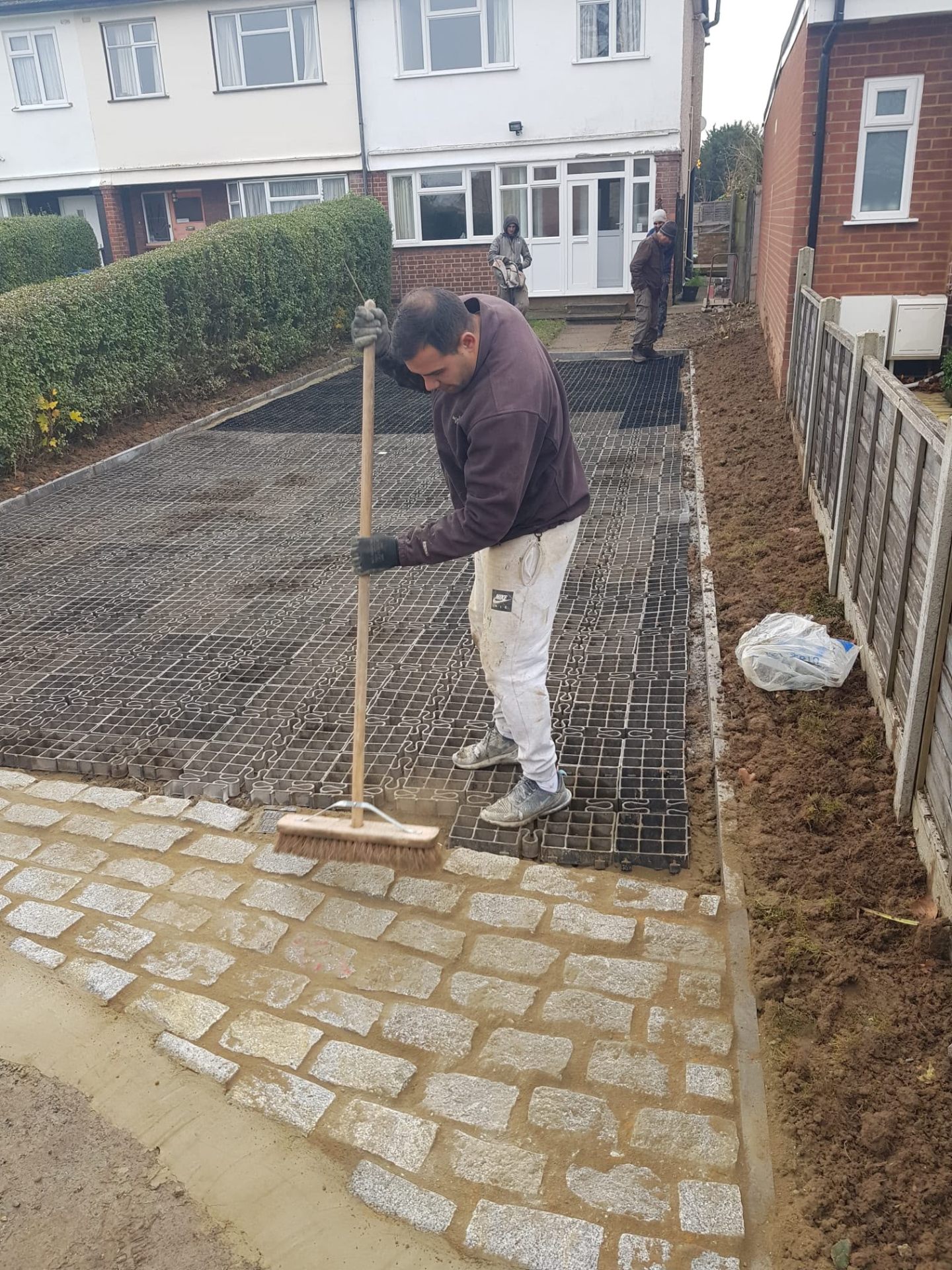 Herringbone block-paved driveway with dark border course