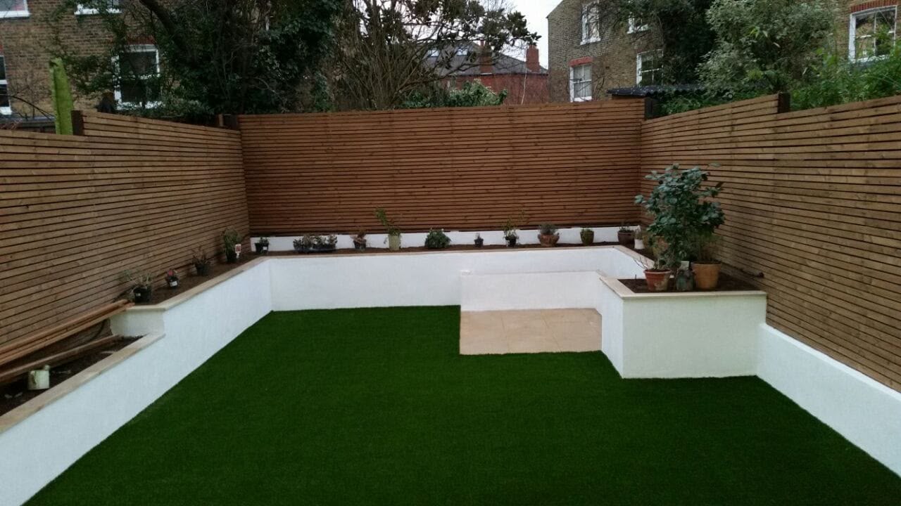 Artificial grass lawn installation with clean edging